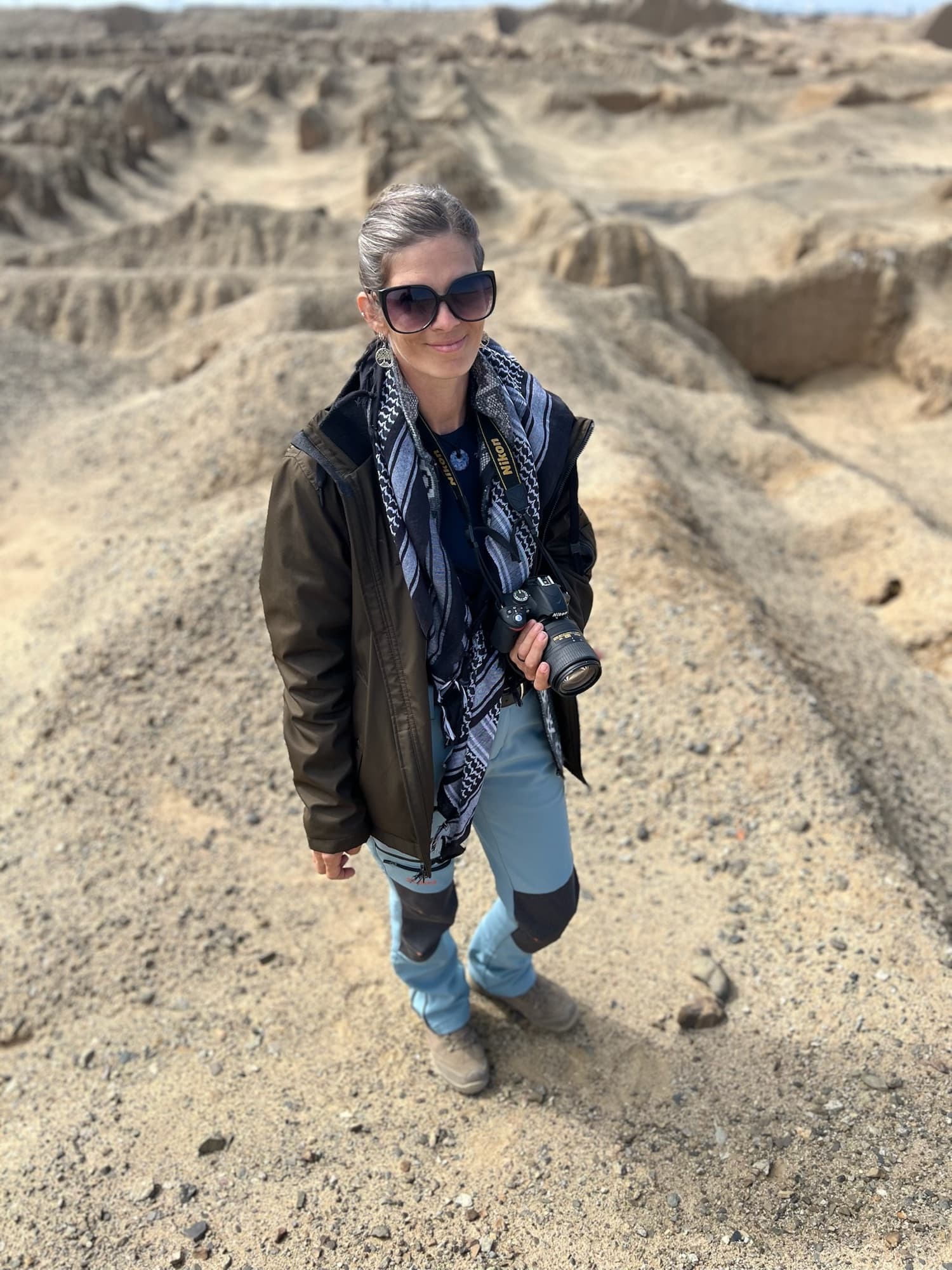 April Iser at Chan Chan, Peru, with her camera